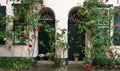 Two beautiful wooden doors and flowers in pots in the street of old town, Lubeck, Germany Royalty Free Stock Photo