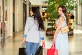 Two women walking in shopping mall Royalty Free Stock Photo