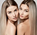 Two beautiful young european sisters friends or girlfriends women with clean skin and well-groomed hair naked