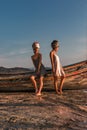 Two beautiful young fashion models on the beach at sea boat Royalty Free Stock Photo