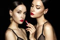 Two beautiful young ladies with red lipstick Royalty Free Stock Photo