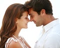 Tender words and sweet smiles. Two beautiful young lovers sharing an intimate moment together. Royalty Free Stock Photo