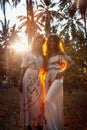 Two beautiful young woman in summer dresses outdoors at sunset Royalty Free Stock Photo