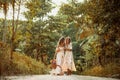 Two beautiful young woman in summer dresses outdoors at sunset Royalty Free Stock Photo