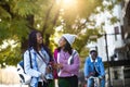 Two beautiful young woman using mobile phone in the street. Royalty Free Stock Photo