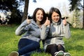 Two beautiful young women giving thumbs up sign Royalty Free Stock Photo