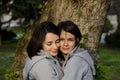 Two beautiful young women hugging outside Royalty Free Stock Photo
