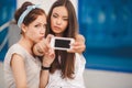 Two beautiful young women making selfie photo Royalty Free Stock Photo