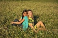 Two beautiful young women sitting in meadow Royalty Free Stock Photo
