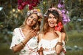 Two beautiful young woman in summer dresses outdoors at sunset Royalty Free Stock Photo