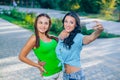 Two beautiful young women using smart phone for Royalty Free Stock Photo