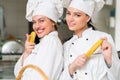 A two beautifull young female chef posing for camera Royalty Free Stock Photo