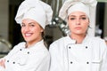 A two beautifull young female chef posing for camera Royalty Free Stock Photo