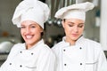 A two beautifull young female chef posing for camera Royalty Free Stock Photo