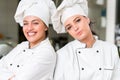 A two beautifull young female chef posing for camera Royalty Free Stock Photo