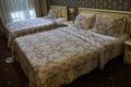 Two beds in a room in vintage style Royalty Free Stock Photo