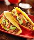 Two beef tacos with cheese, lettuce and tomatoes Royalty Free Stock Photo