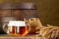 Two beer glasses with bundle of wheat Royalty Free Stock Photo