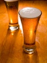 Two beer glasses, focus on first Royalty Free Stock Photo
