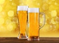 Two beer glasses on table Royalty Free Stock Photo