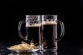 Two beer mugs on table Royalty Free Stock Photo
