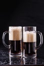 Two beer mugs on table