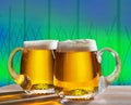 Two beers with hop field Royalty Free Stock Photo