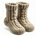 Two Beige Knitted Wool Socks with Cable Pattern on White Background Royalty Free Stock Photo