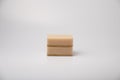 Two beige sponges for washing dishes on a white background Royalty Free Stock Photo