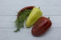 Two bell peppers: red and yellow, hot peppers and a bunch of dill Royalty Free Stock Photo