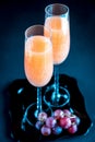 Two bellini cocktails with bunch of grapes Royalty Free Stock Photo