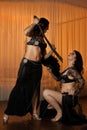 Two belly dancers preforming on stage Royalty Free Stock Photo
