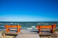 Two benches by the sea