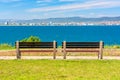 two benches on the sunny beach shore. Royalty Free Stock Photo