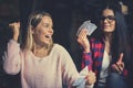 Two best friends playing game cards at home. Royalty Free Stock Photo