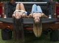 Two best friends tailgate in pick-up truck
