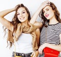 Two best friends teenage girls together having fun, posing emotional on white background, besties happy smiling, making Royalty Free Stock Photo