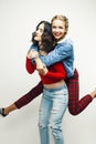 Two best friends teenage girls together having fun, posing emotional on white background, besties happy smiling, making Royalty Free Stock Photo