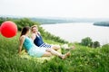 Two best girl friends sitting on the grass Royalty Free Stock Photo