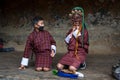 Two boys play with terrifying mask of mask dance , Bumthang, central Bhutan. Royalty Free Stock Photo