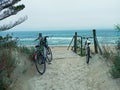 Two bicycles on the beach by the sea Royalty Free Stock Photo
