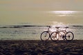 Two bicycles  on the beach Royalty Free Stock Photo