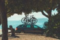Two bicycles on car roof bike rack ar Kvarner gulf of Adriatic sea