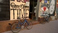 Two bicycles at the entrance to the building, graffiti on the walls in Serbia