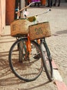 Two bicycles leaning against a post in Marrakesh market square Royalty Free Stock Photo