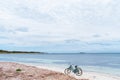 Two bicycles parked on sandy beach on Rottnest Island, Western Australia. Royalty Free Stock Photo