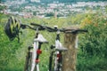 Two bicycles stand wth city view on background Royalty Free Stock Photo