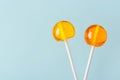 Two big bright tasty lollipops on white sticks Royalty Free Stock Photo