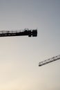 Construction cranes in the evening sky Royalty Free Stock Photo