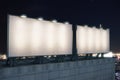 Two big empty billboard on the background of the city at night, Royalty Free Stock Photo